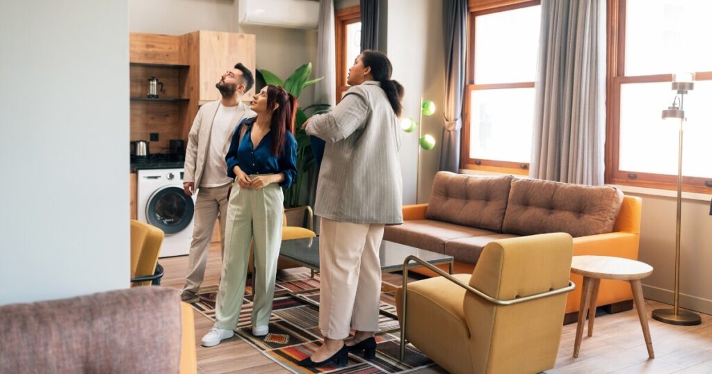 A couple and real estate agent at an apartment inspection