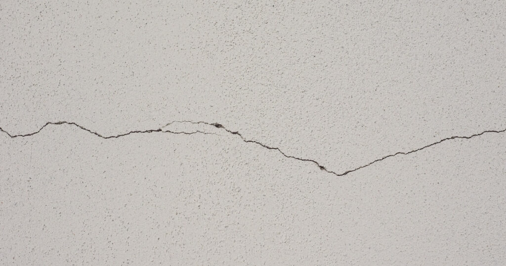 A visible crack in a white wall