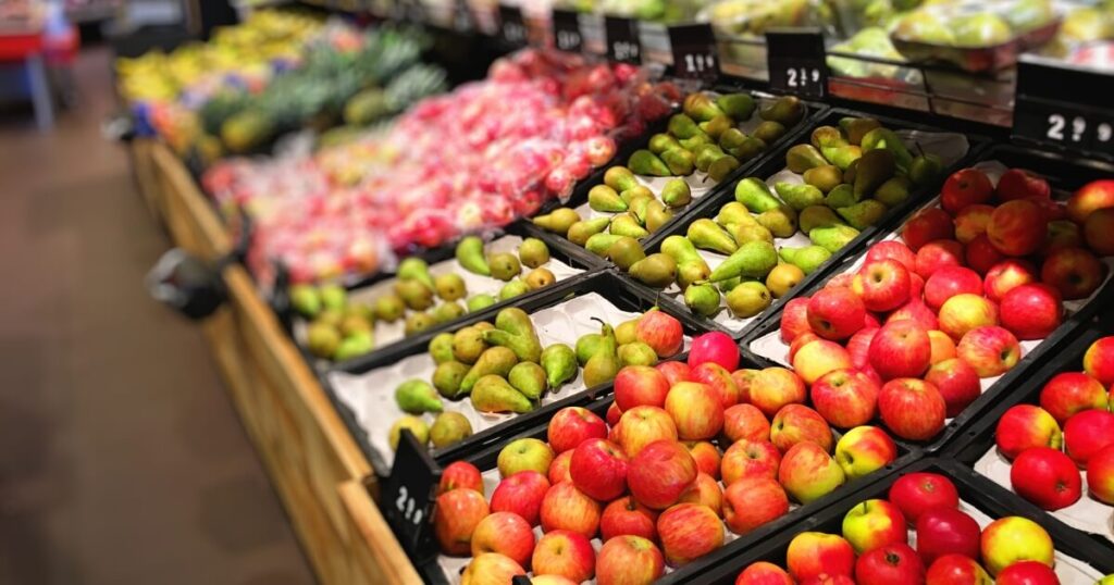 Apples and pears on display at the supermarket